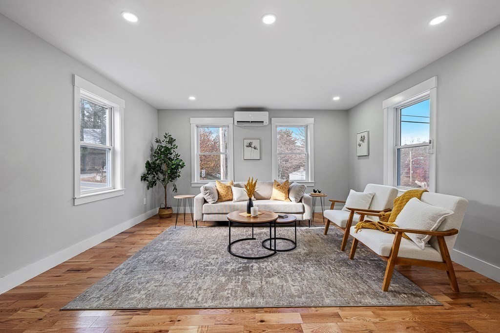 108 Paxton Road Spencer, MA 01562 - Photo 13 of 26 a living room with furniture a rug and a window