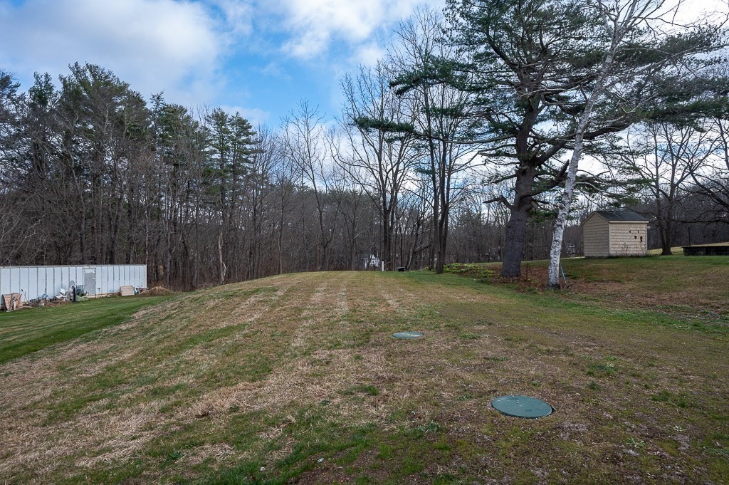 108 Paxton Road Spencer, MA 01562 - Photo 23 of 26 a view of backyard with tree