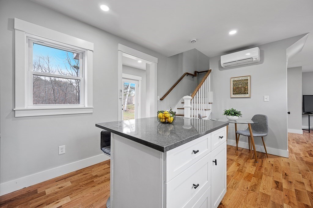 108 Paxton Road Spencer, MA 01562 - Photo 7 of 26 a kitchen that has a table and chairs in it