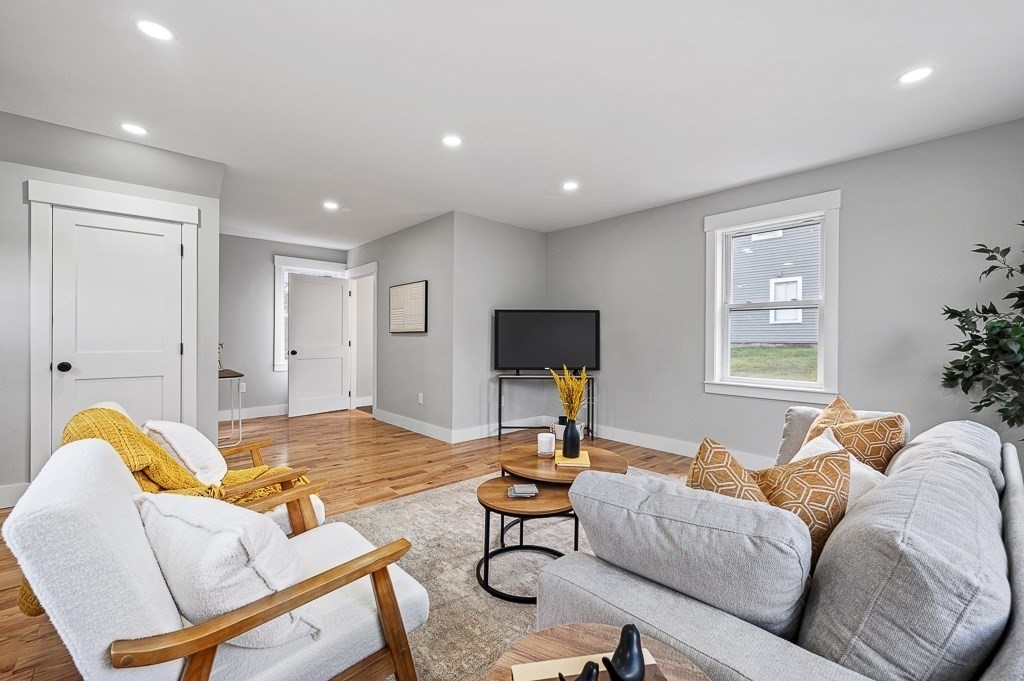 108 Paxton Road Spencer, MA 01562 - Photo 9 of 26 a living room with furniture and a flat screen tv