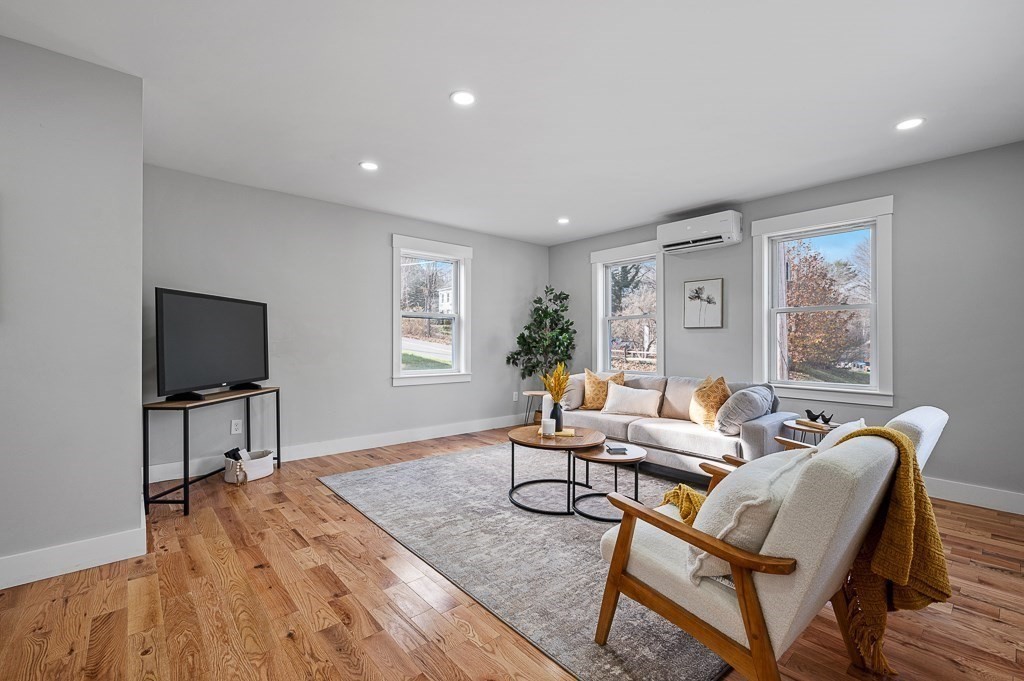 108 Paxton Road Spencer, MA 01562 - Photo 10 of 26 a living room with furniture and a flat screen tv