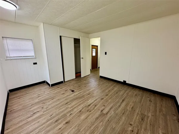 a bathroom with a granite countertop sink mirror and a bathtub