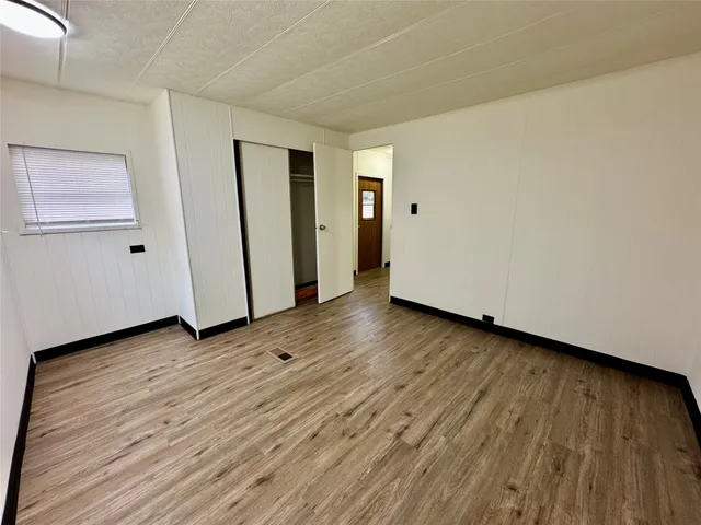 a bathroom with a granite countertop sink mirror and a bathtub