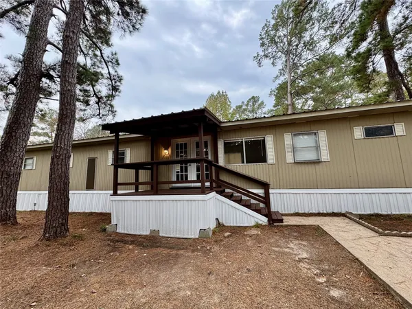 a view of balcony with wooden floor