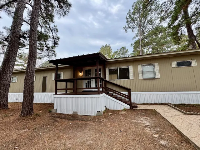 a view of balcony with wooden floor