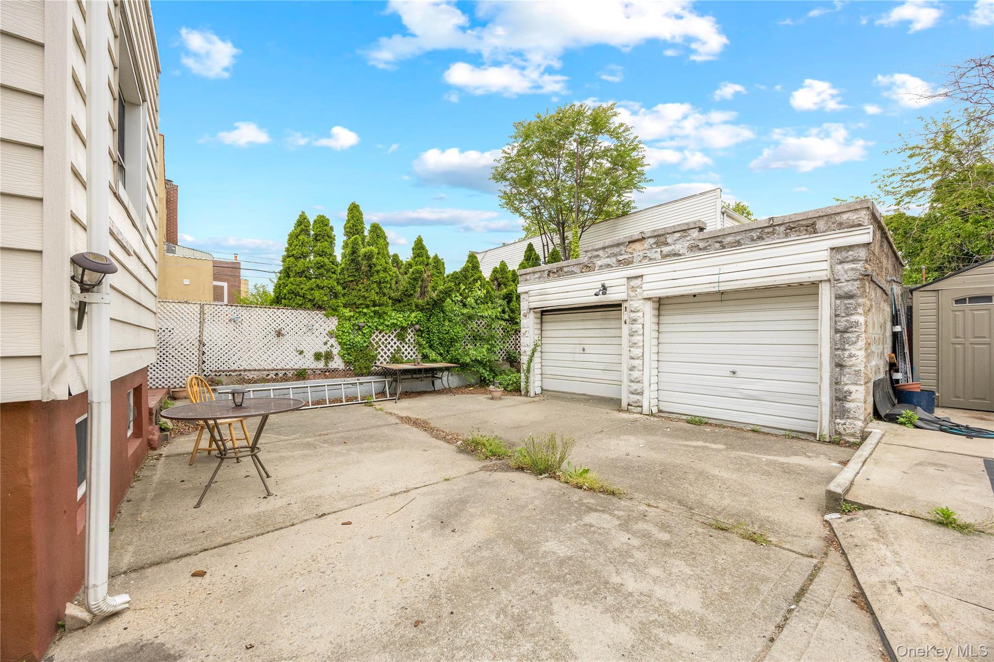 37-07 20th Road Queens, NY 11105 - Photo 17 of 24 a view of a house with a patio