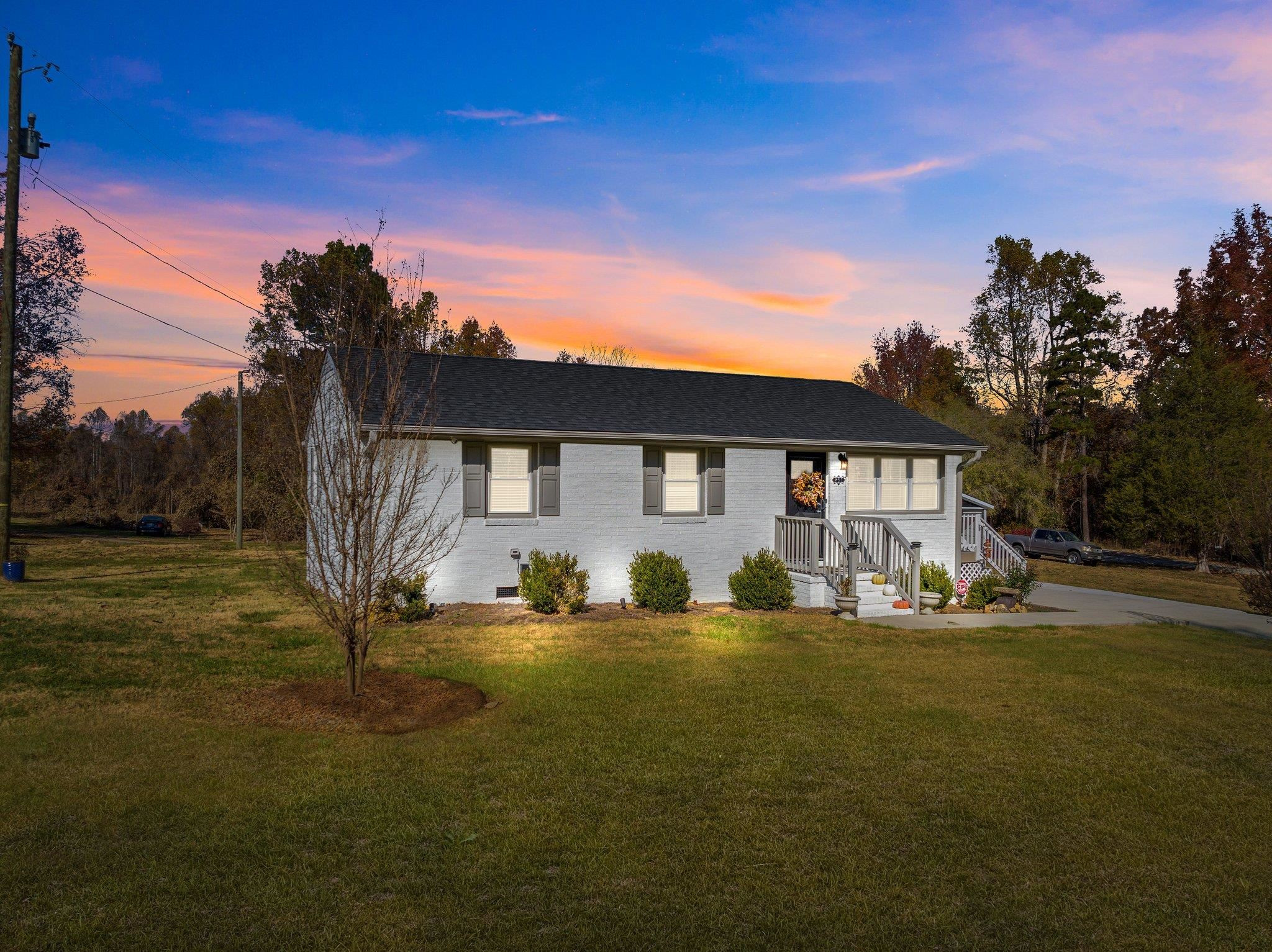 761 Jones Lester Road Roxboro, NC 27574 - Photo 1 of 27 a front view of a house with garden