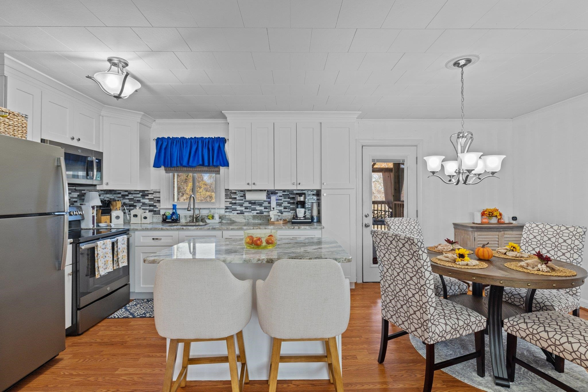 761 Jones Lester Road Roxboro, NC 27574 - Photo 11 of 27 a kitchen with a dining table and chairs