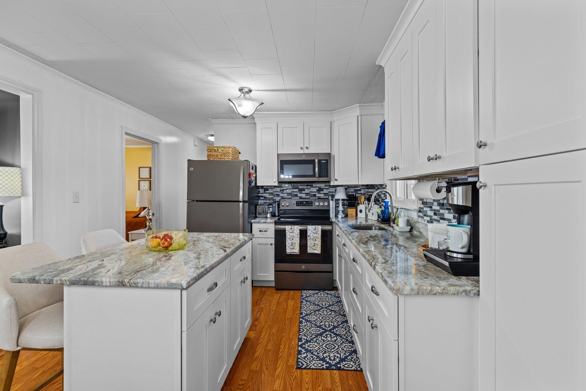 761 Jones Lester Road Roxboro, NC 27574 - Photo 15 of 27 a kitchen with stainless steel appliances granite countertop a refrigerator and a stove
