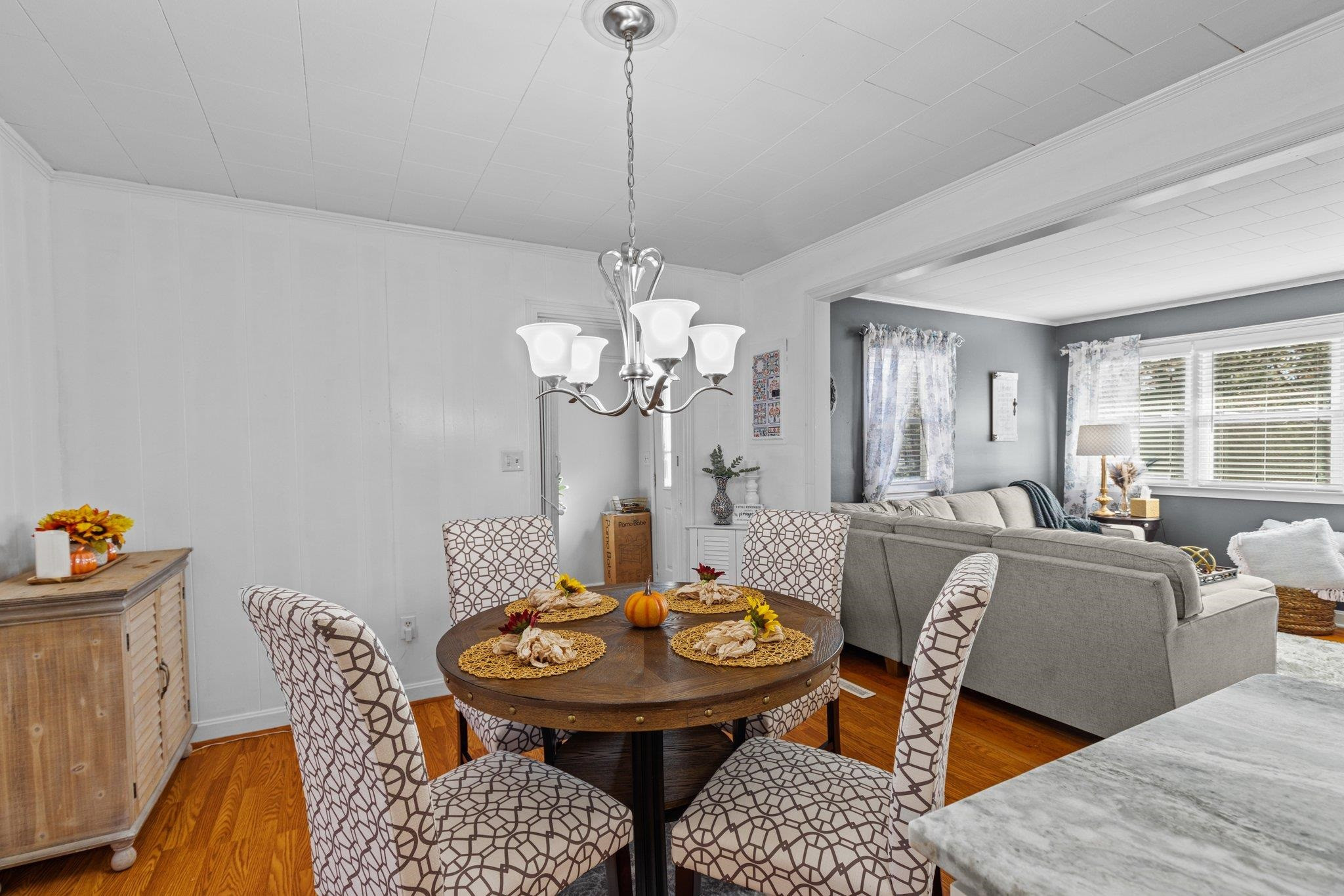 761 Jones Lester Road Roxboro, NC 27574 - Photo 16 of 27 a view of a dining room with furniture and wooden floor
