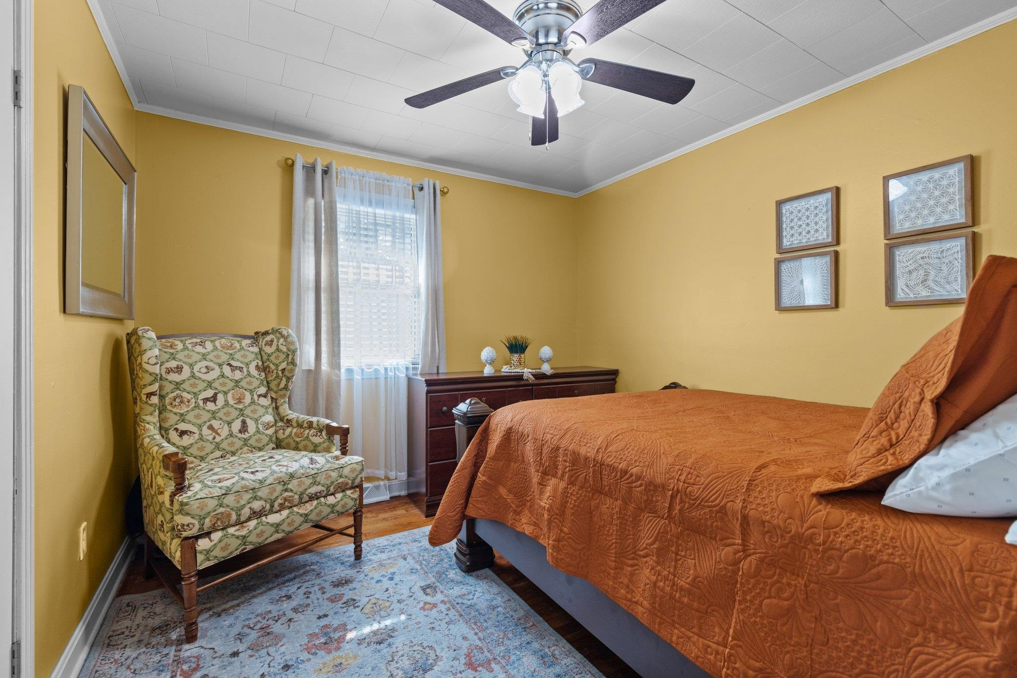 761 Jones Lester Road Roxboro, NC 27574 - Photo 23 of 27 a bedroom with a bed and ceiling fan