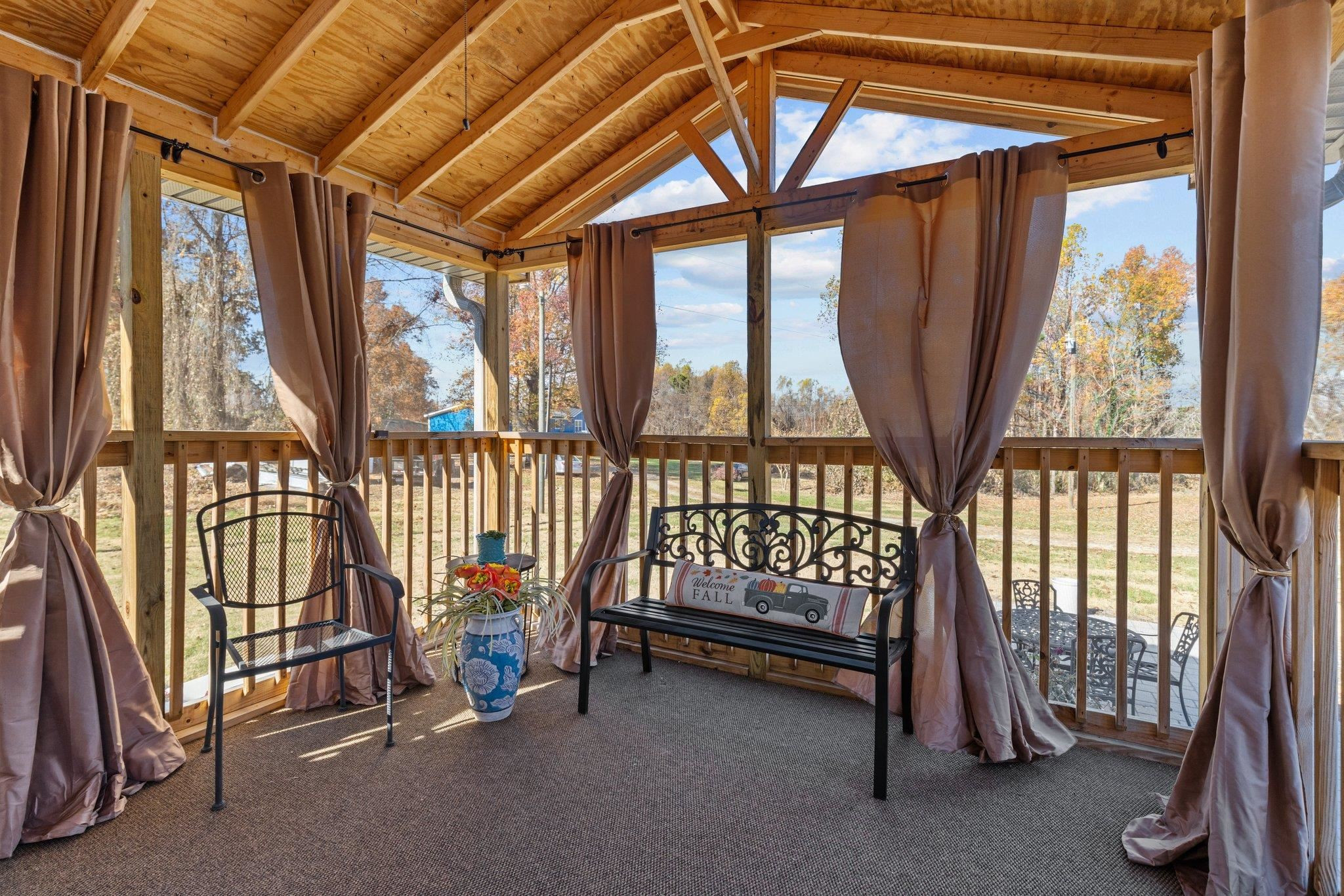 761 Jones Lester Road Roxboro, NC 27574 - Photo 25 of 27 a view of front door with furniture and a window