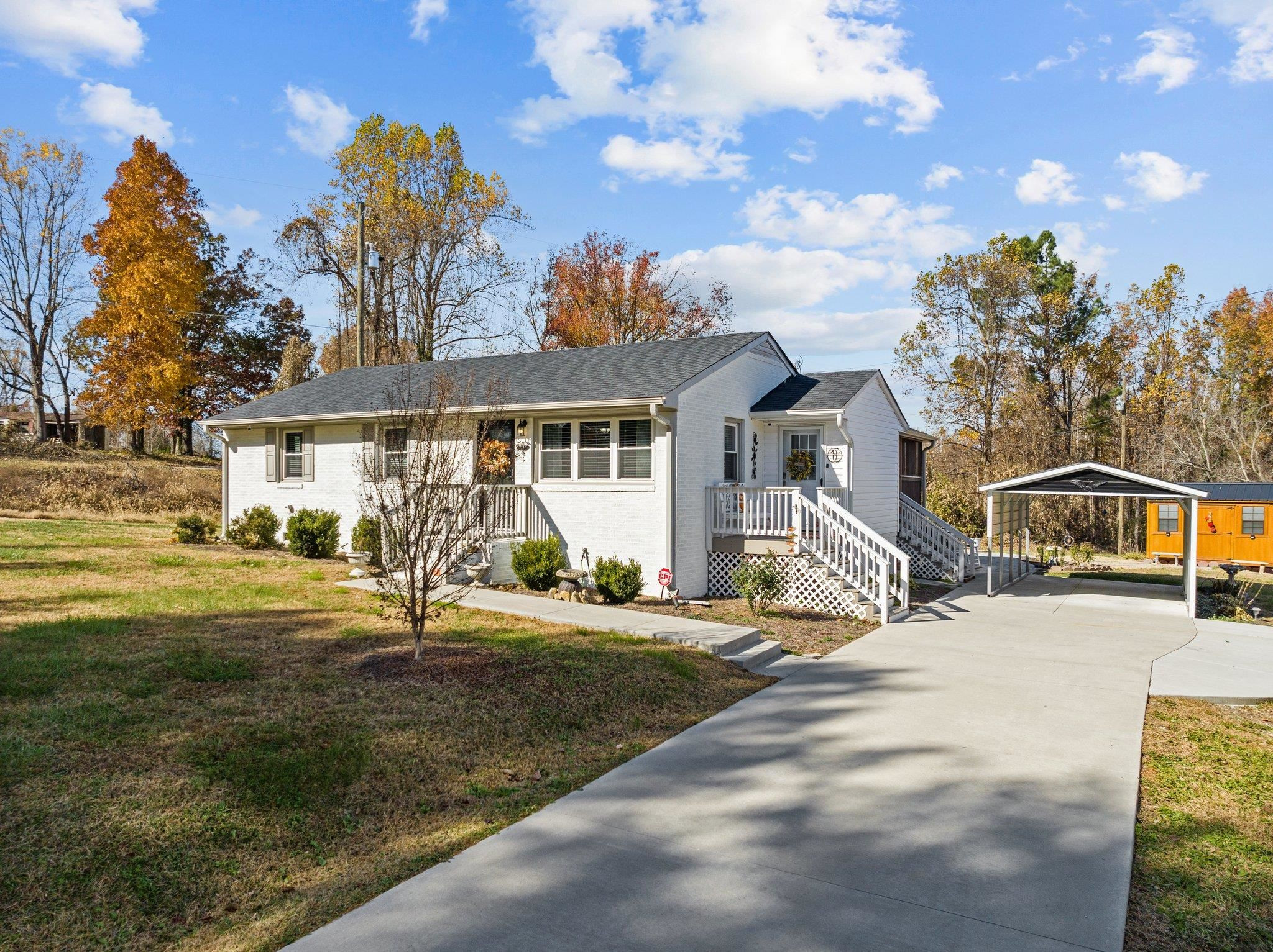 761 Jones Lester Road Roxboro, NC 27574 - Photo 3 of 27 a front view of a house with garden