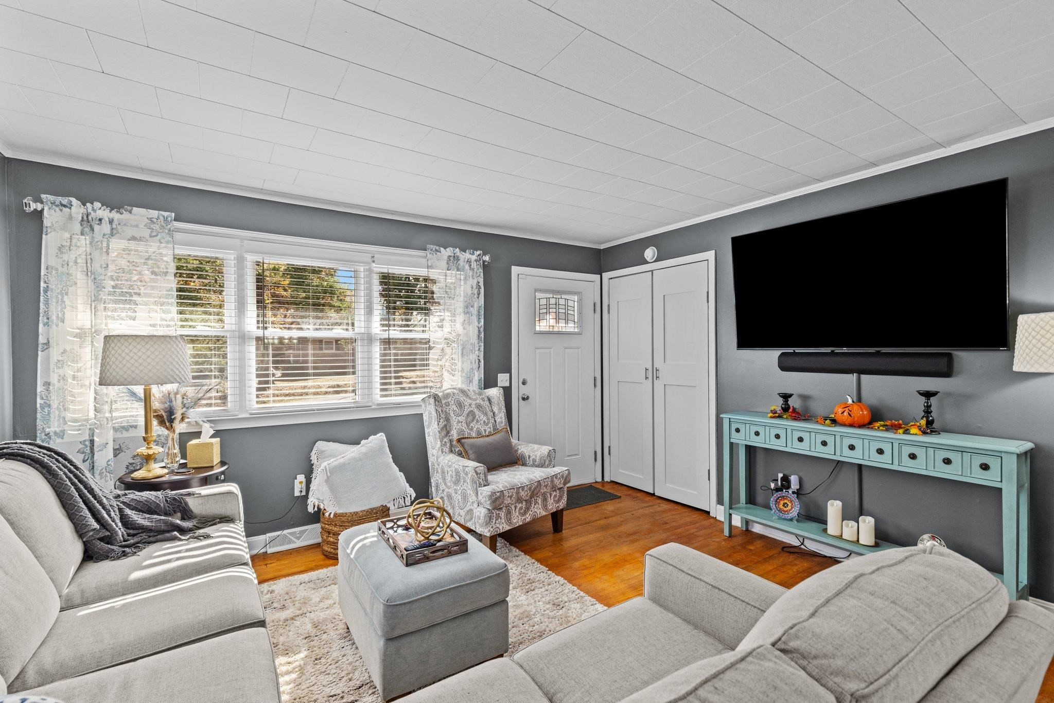 761 Jones Lester Road Roxboro, NC 27574 - Photo 6 of 27 a living room with furniture and a flat screen tv