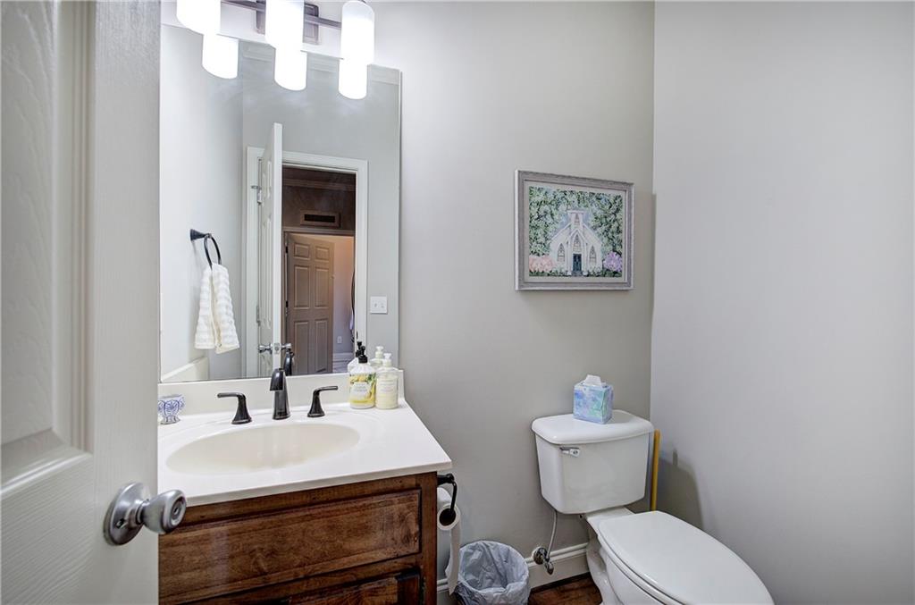 618 Manor Way Cartersville, GA 30120 - Photo 14 of 35 a bathroom with a sink mirror and toilet