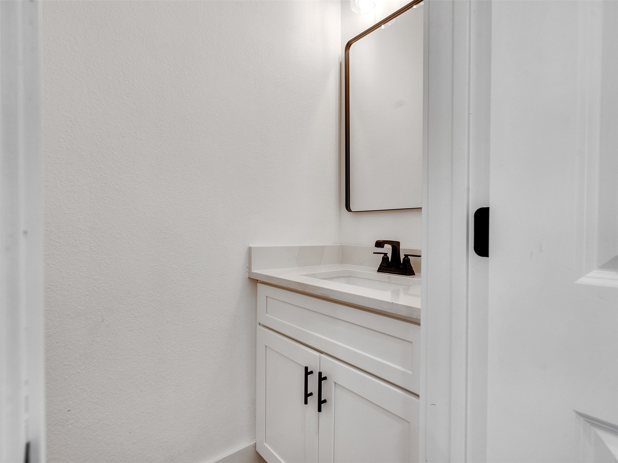4421 Reed Road, Unit A AND B Houston, TX 77051 - Photo 13 of 39 a bathroom with a sink and a mirror