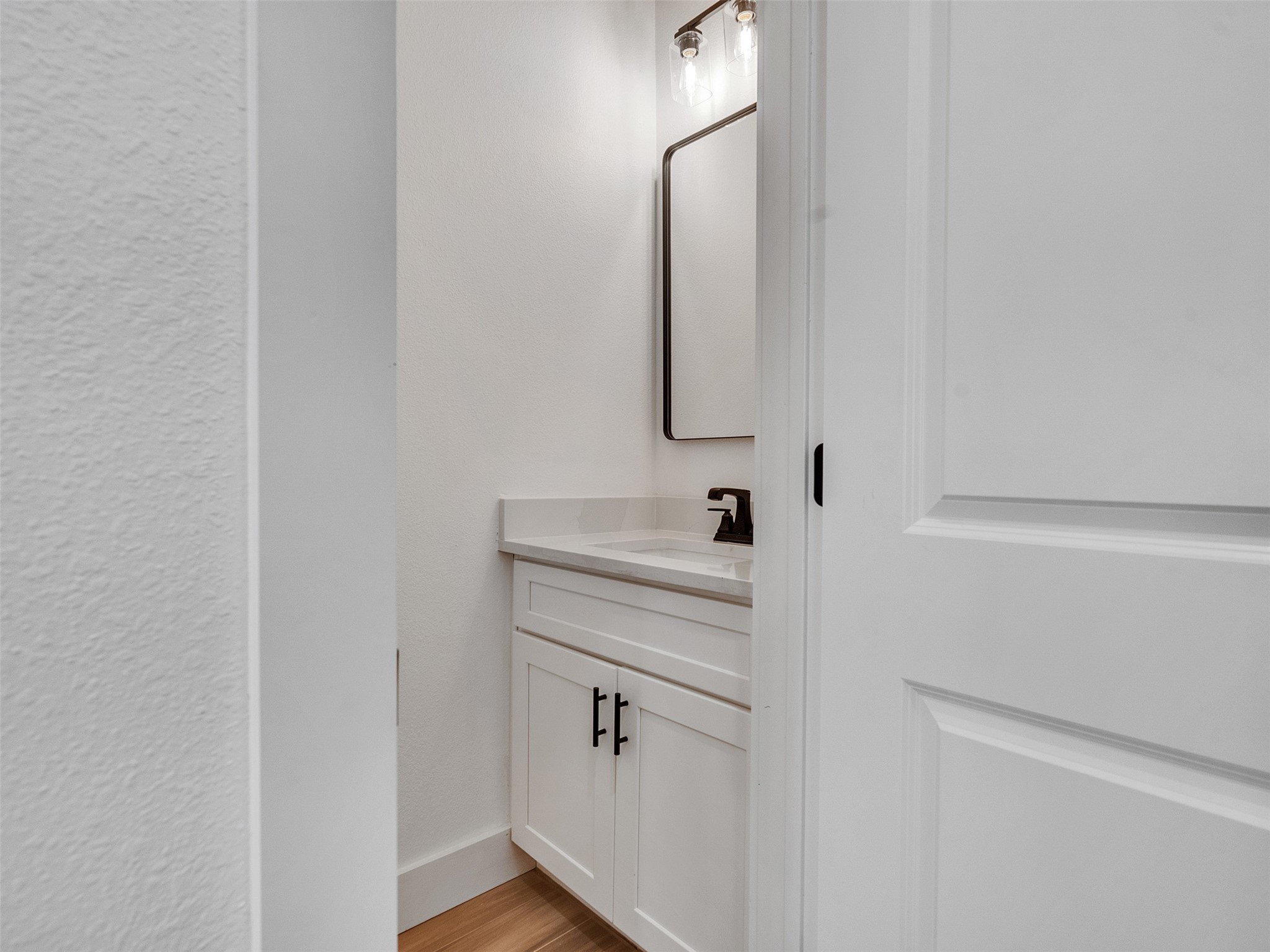 4421 Reed Road, Unit A AND B Houston, TX 77051 - Photo 14 of 39 a bathroom with a sink and a mirror