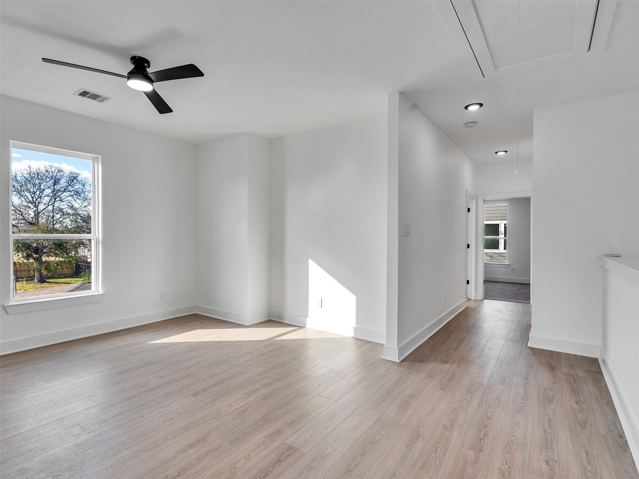 4421 Reed Road, Unit A AND B Houston, TX 77051 - Photo 18 of 39 a view of an empty room with a window and wooden floor