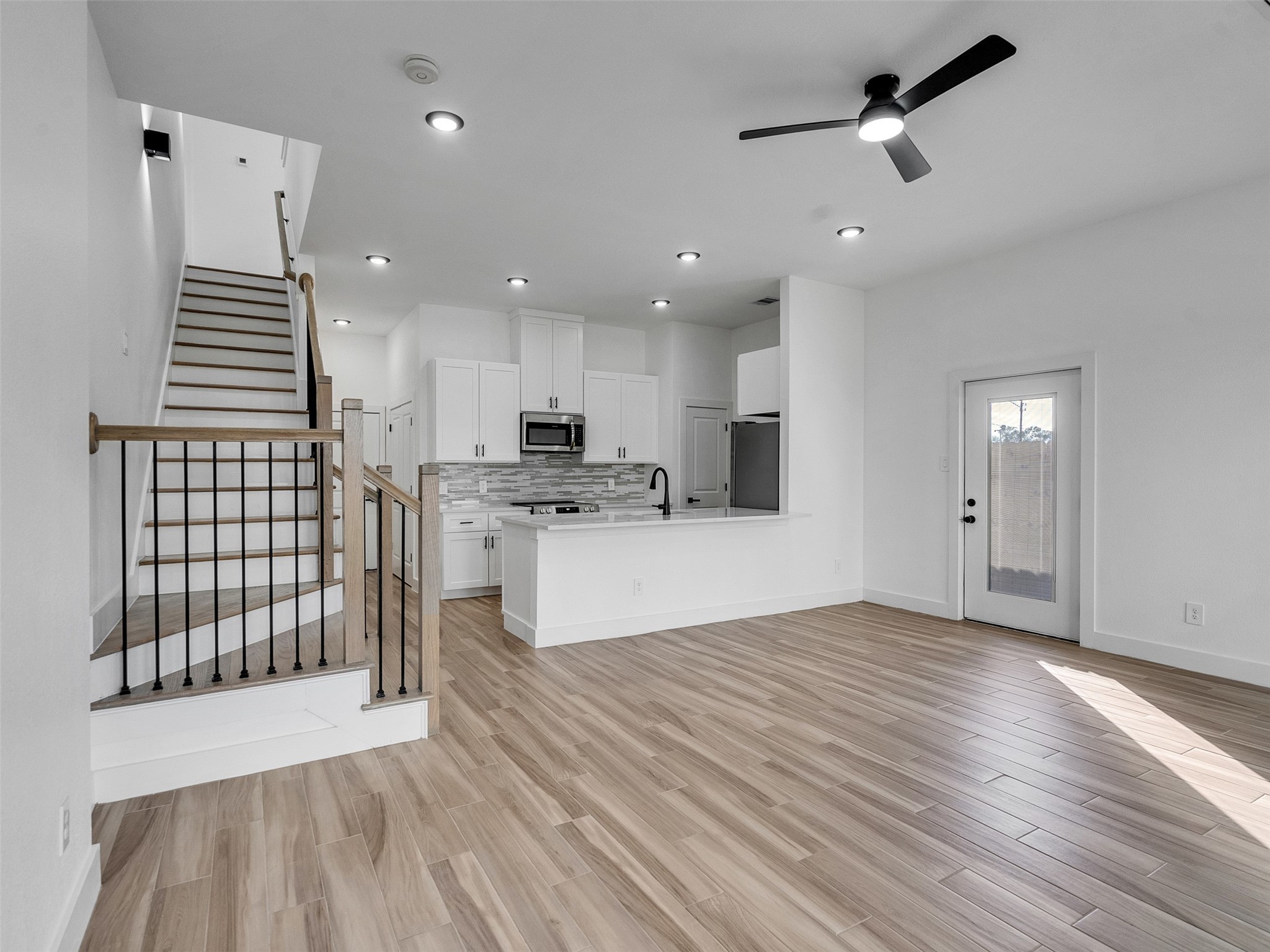 4421 Reed Road, Unit A AND B Houston, TX 77051 - Photo 4 of 39 a view of kitchen with refrigerator and white wooden cabinets