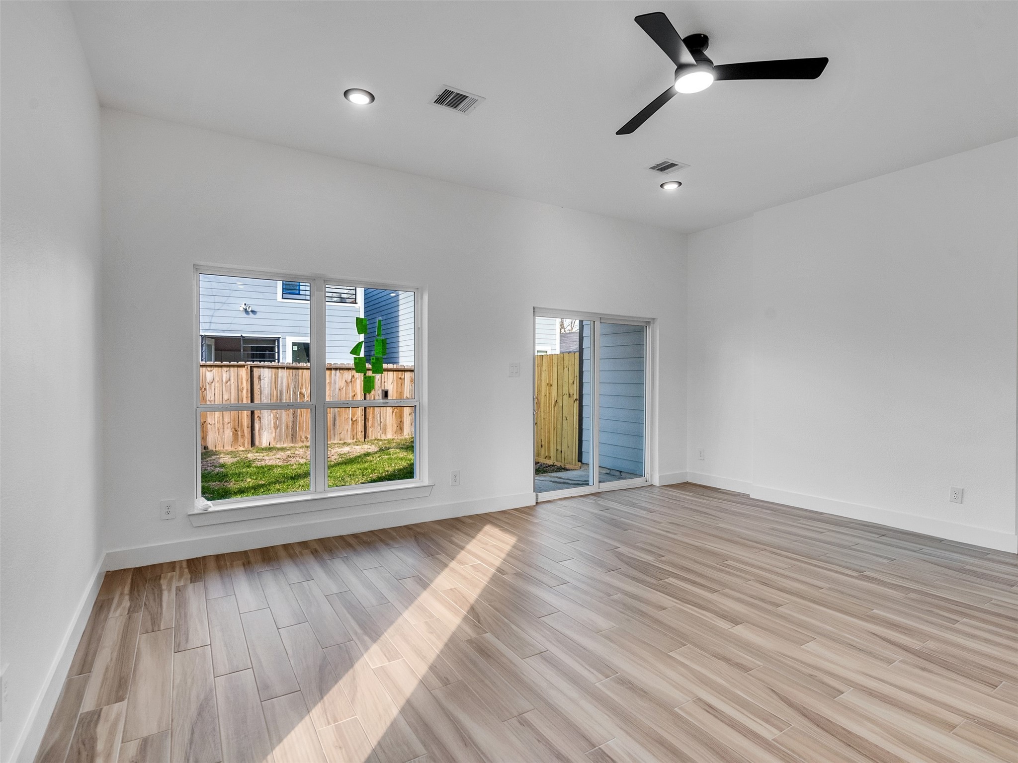 4421 Reed Road, Unit A AND B Houston, TX 77051 - Photo 6 of 39 an empty room with window and wooden floor