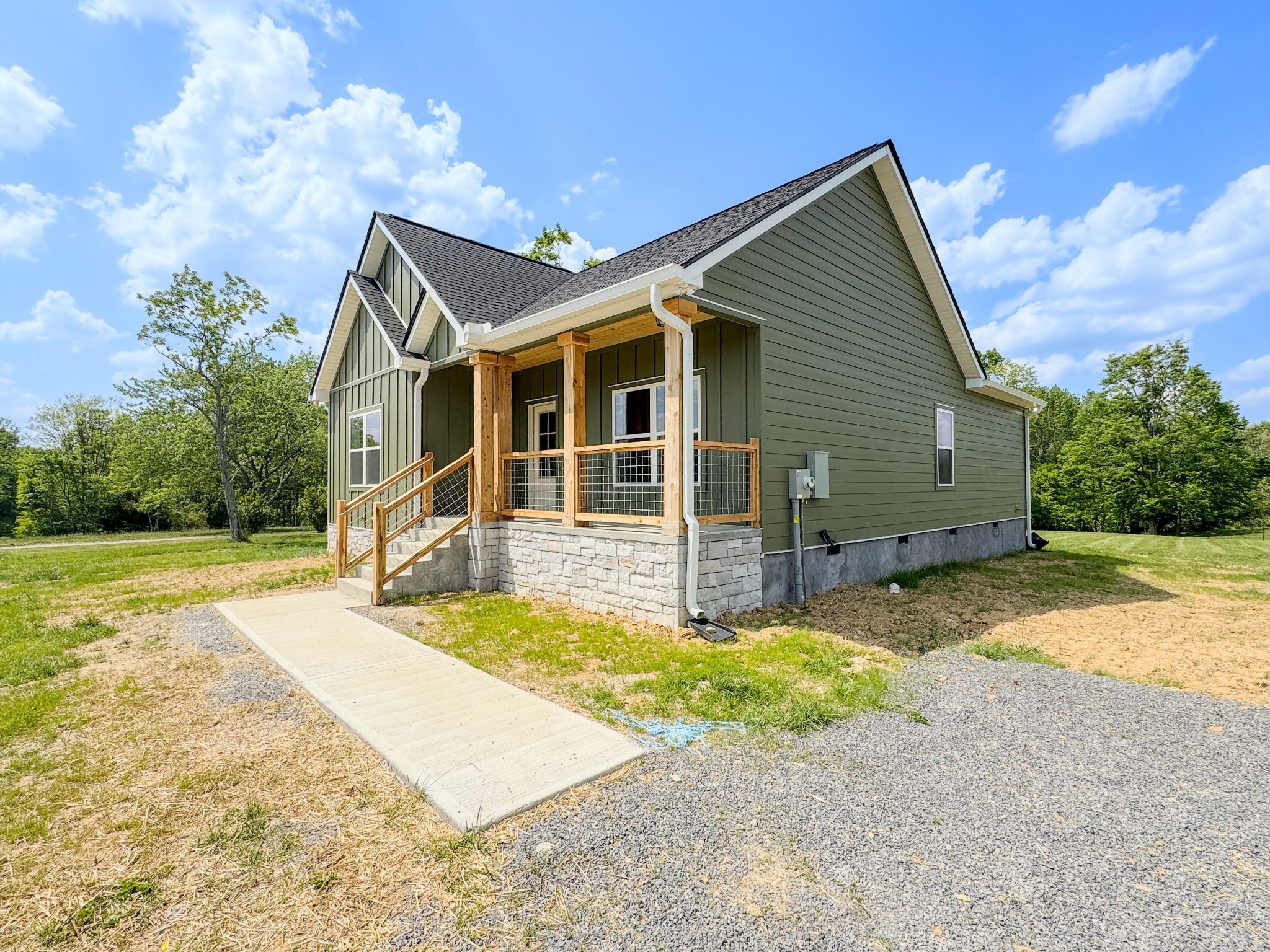 181 Rock House Hollow Road Bethpage, TN 37022 - Photo 5 of 51 a view of a house with backyard and trees