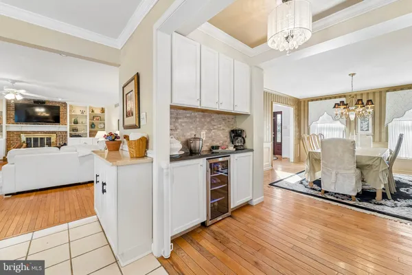 a kitchen with a sink a counter top space stainless steel appliances and cabinets