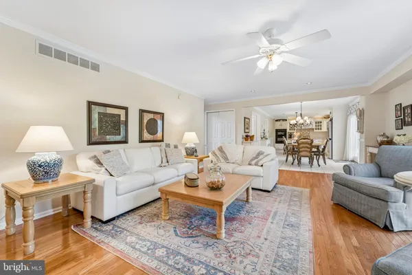 a living room with furniture and a lamp