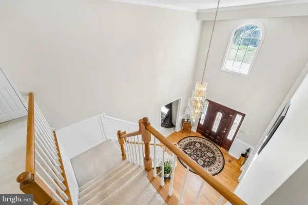 a view of an entryway with wooden floor