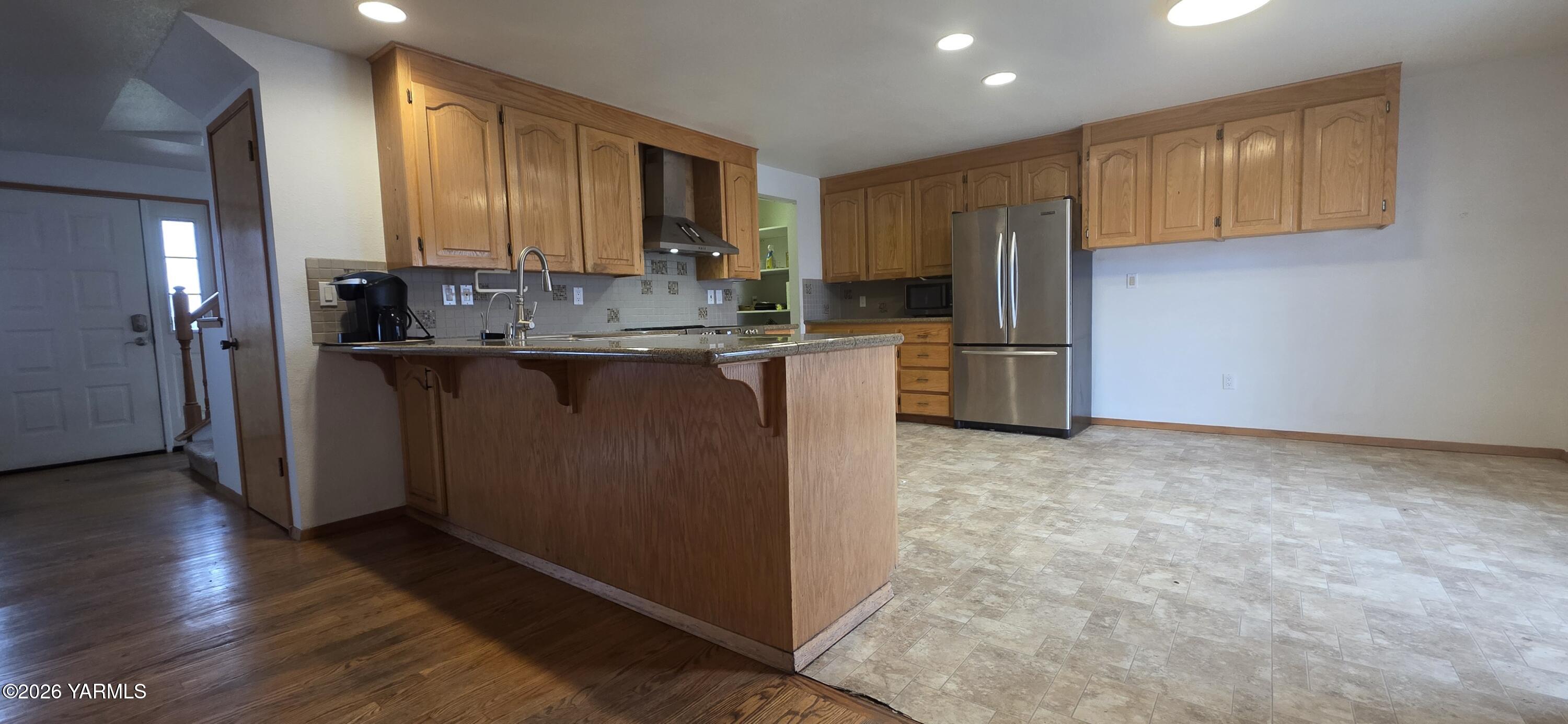 8601 Scenic Drive Yakima, WA 98908 - Photo 7 of 52 a kitchen with refrigerator and cabinets