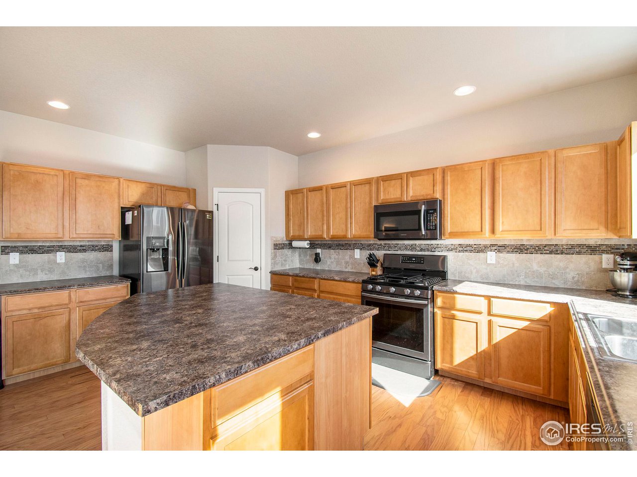 8524 15th St Road Greeley, CO 80634 - Photo 6 of 29 Huge kitchen island.