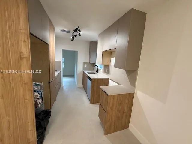 a dining room with furniture and a chandelier