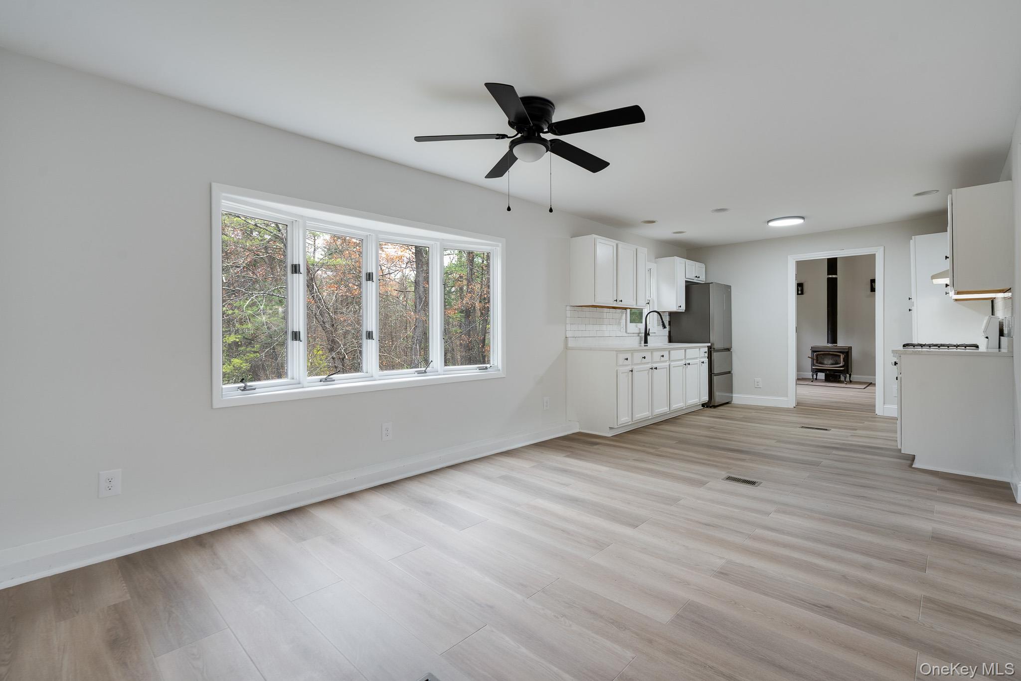 356 Sands Road Middletown, NY 10941 - Photo 7 of 22 a view of an empty room with wooden floor and a window