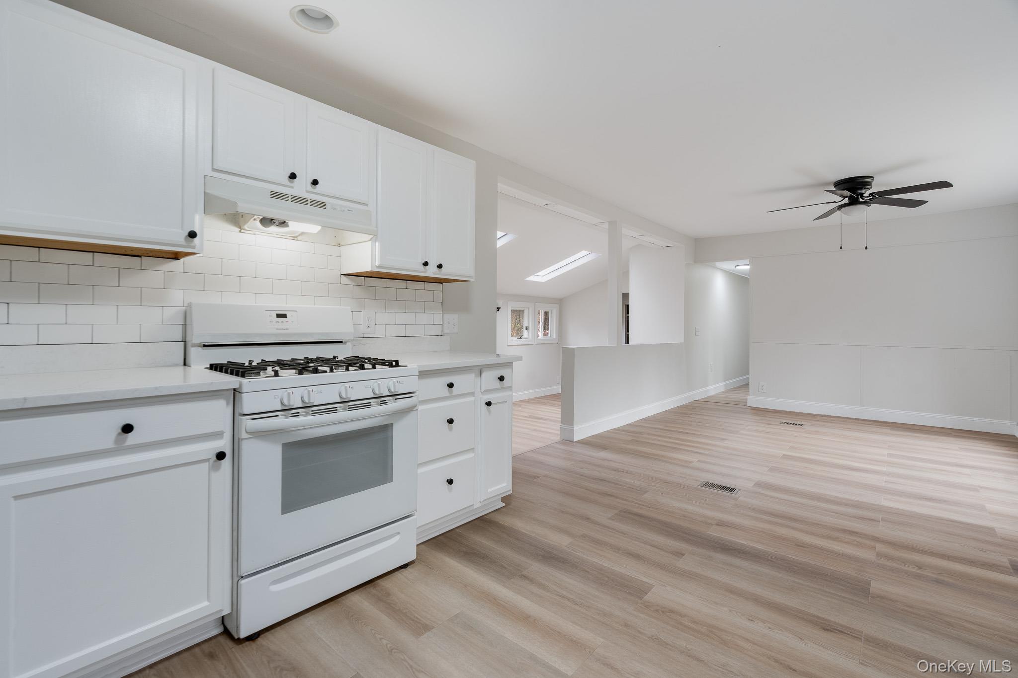 356 Sands Road Middletown, NY 10941 - Photo 9 of 22 a kitchen with granite countertop a stove and a sink