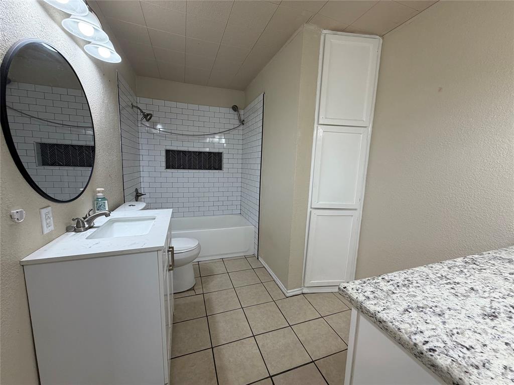 532 Northwest King Street Burleson, TX 76028 - Photo 10 of 17 a bathroom with a sink and mirror