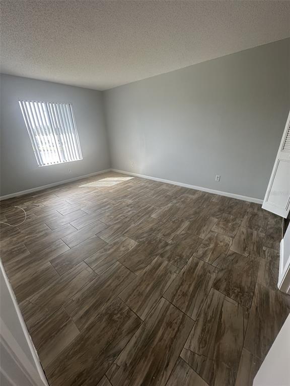 8215 Sun Spring Circle, Unit 63 Orlando, FL 32825 - Photo 14 of 22 an empty room with windows