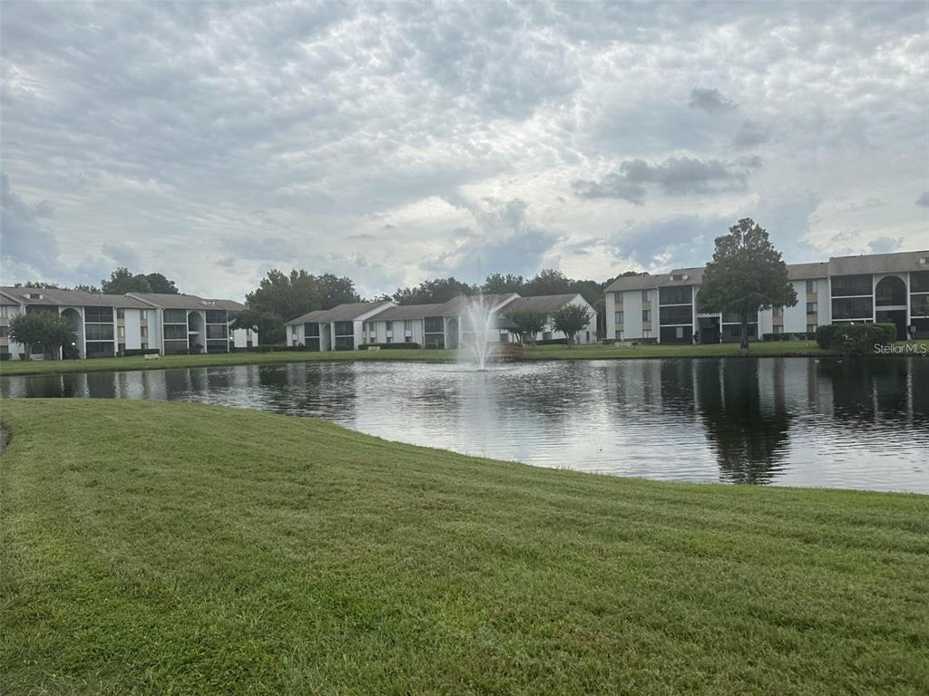 8215 Sun Spring Circle, Unit 63 Orlando, FL 32825 - Photo 19 of 22 a view of a lake with houses
