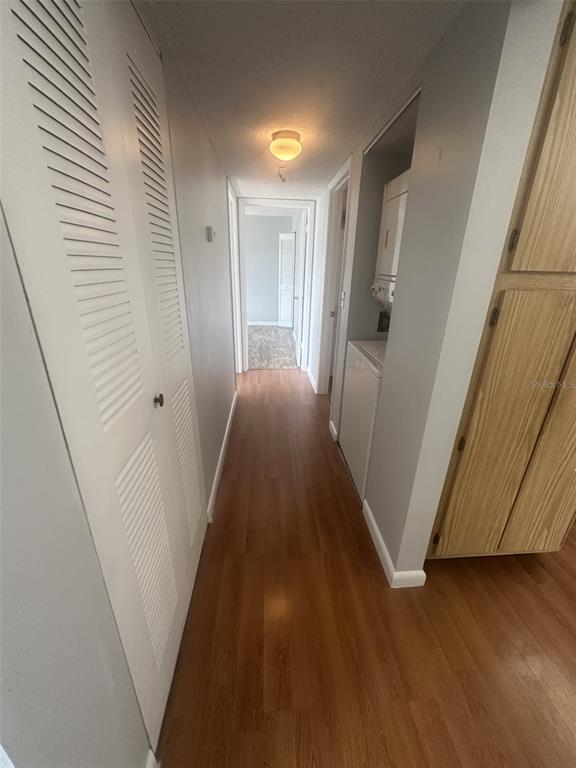 8215 Sun Spring Circle, Unit 63 Orlando, FL 32825 - Photo 8 of 22 a view of a hallway with wooden floor and staircase