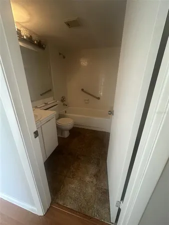 a bathroom with a sink and toilet