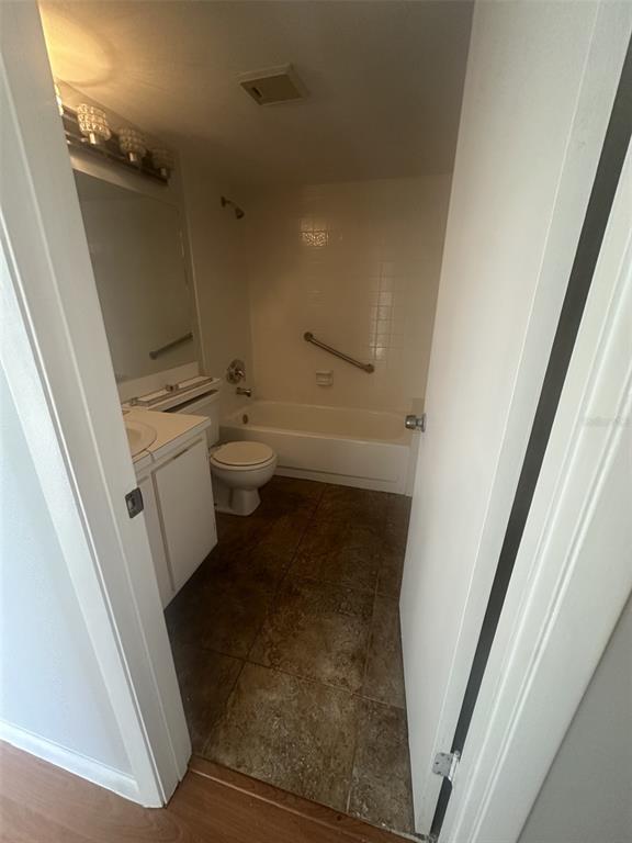 8215 Sun Spring Circle, Unit 63 Orlando, FL 32825 - Photo 9 of 22 a bathroom with a sink and toilet