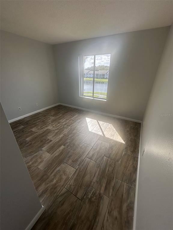 8215 Sun Spring Circle, Unit 63 Orlando, FL 32825 - Photo 10 of 22 an empty room with windows