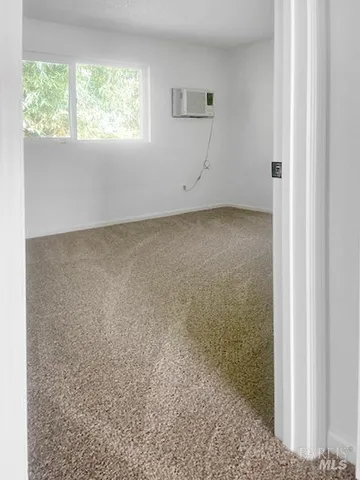 a bathroom with a sink vanity mirror and toilet