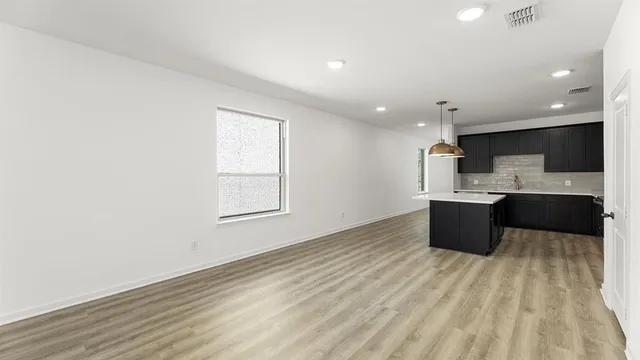 a view of kitchen with wooden floor