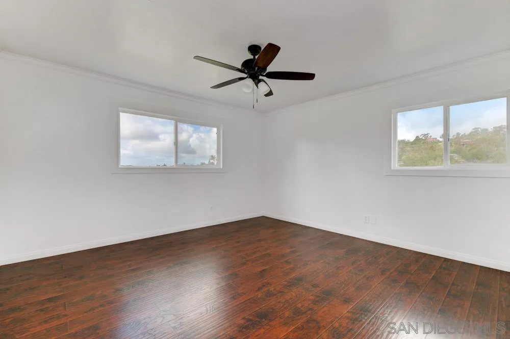 1105 Hamlet Drive El Cajon, CA 92021 - Photo 11 of 26 a view of an empty room with wooden floor and a window