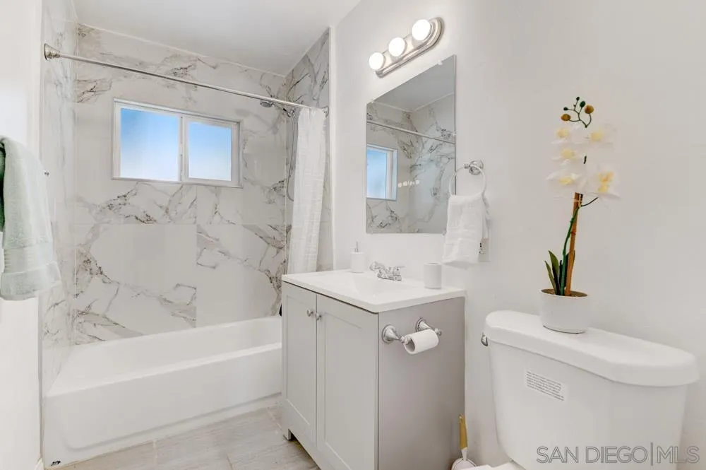 1105 Hamlet Drive El Cajon, CA 92021 - Photo 13 of 26 a bathroom with a sink a toilet and shower