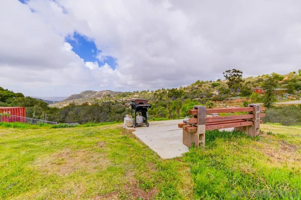 1105 Hamlet Drive El Cajon, CA 92021 - Photo 20 of 26 a backyard of a house with table and chairs