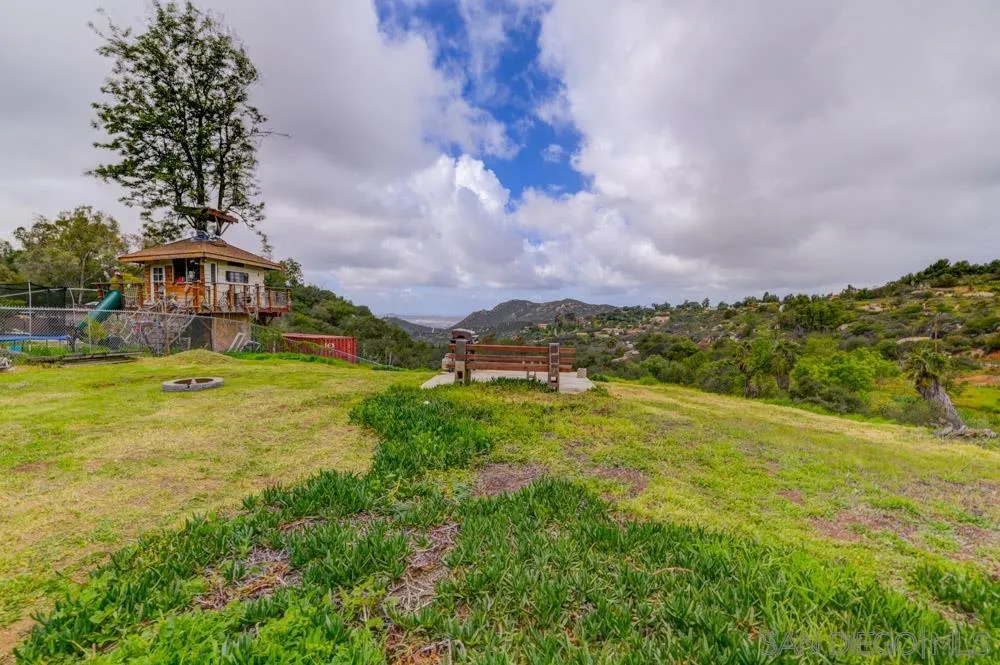 1105 Hamlet Drive El Cajon, CA 92021 - Photo 24 of 26 a view of a big yard with swimming pool and green space
