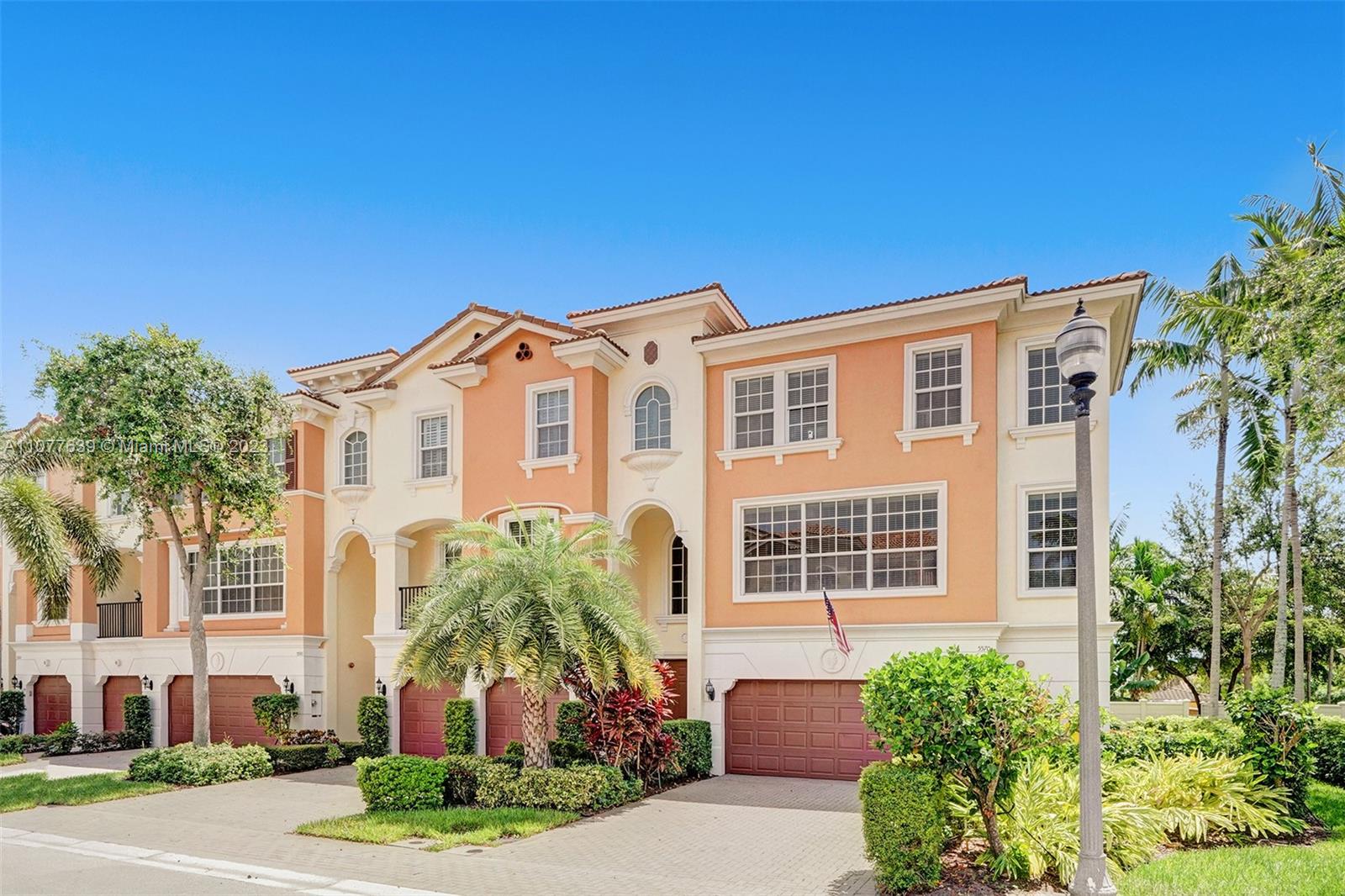 5570 Northeast Trieste Way Boca Raton, FL 33487 - Photo 1 of 1 a front view of a house with a yard