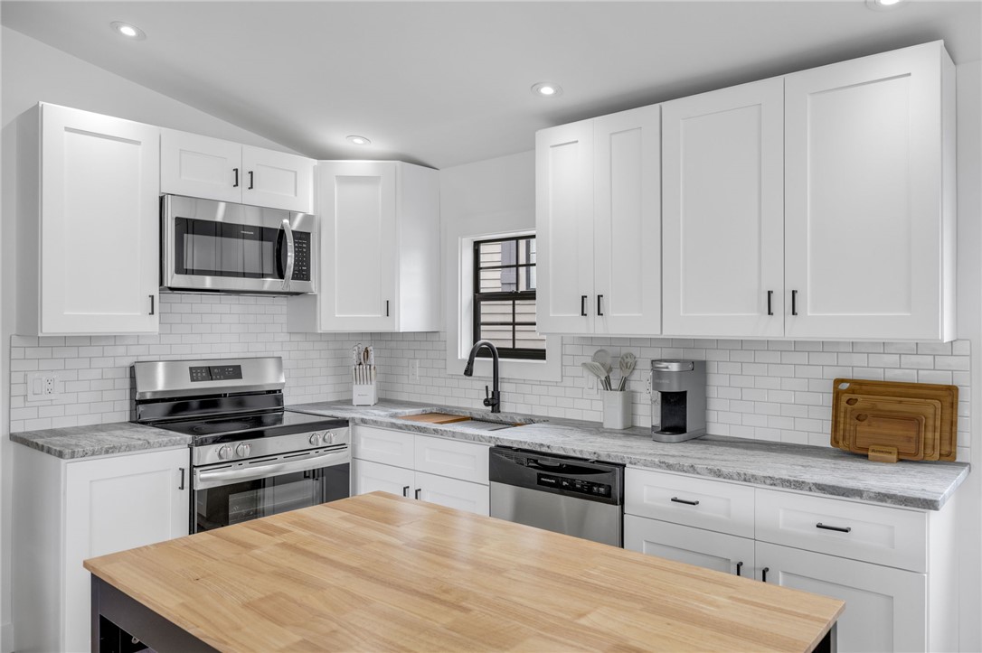 1230 Melton Road, Unit 30 West Union, SC 29696 - Photo 12 of 42 A well-lit kitchen with sleek stainless steel appliances and ample counter space for culinary endeavors.