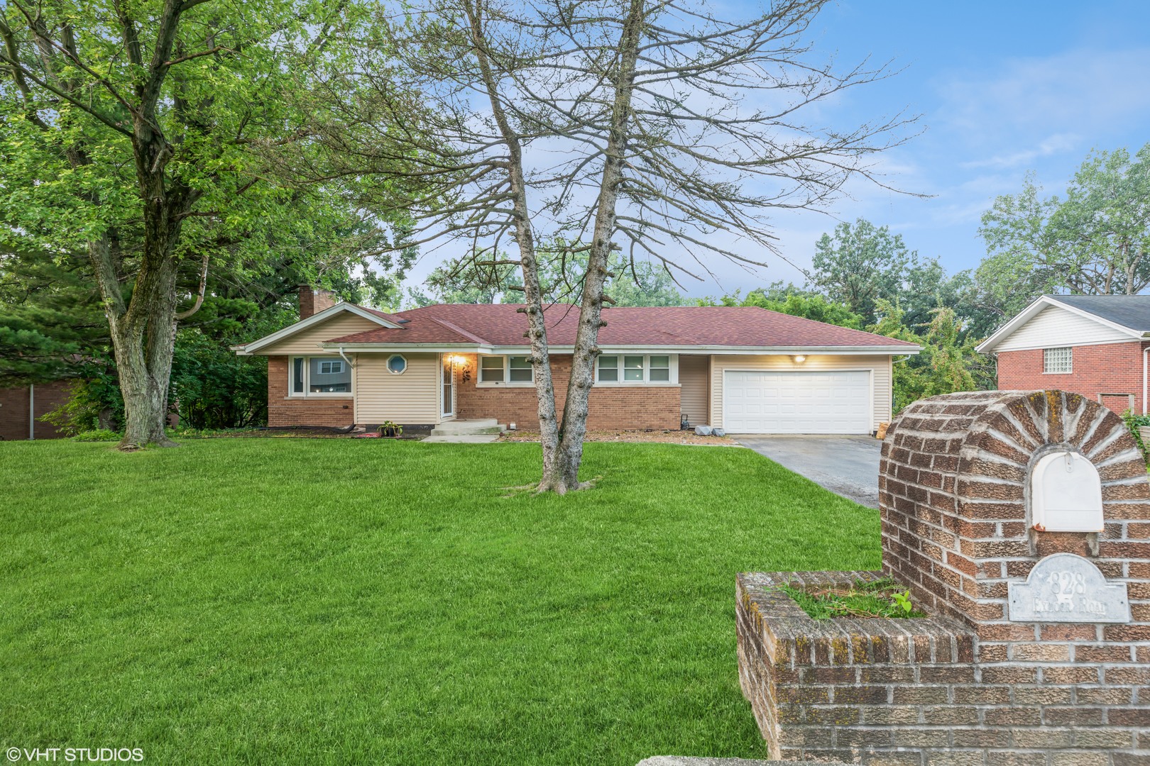828 Exmoor Road Olympia Fields, IL 60461 - Photo 2 of 9 a front view of a house with garden