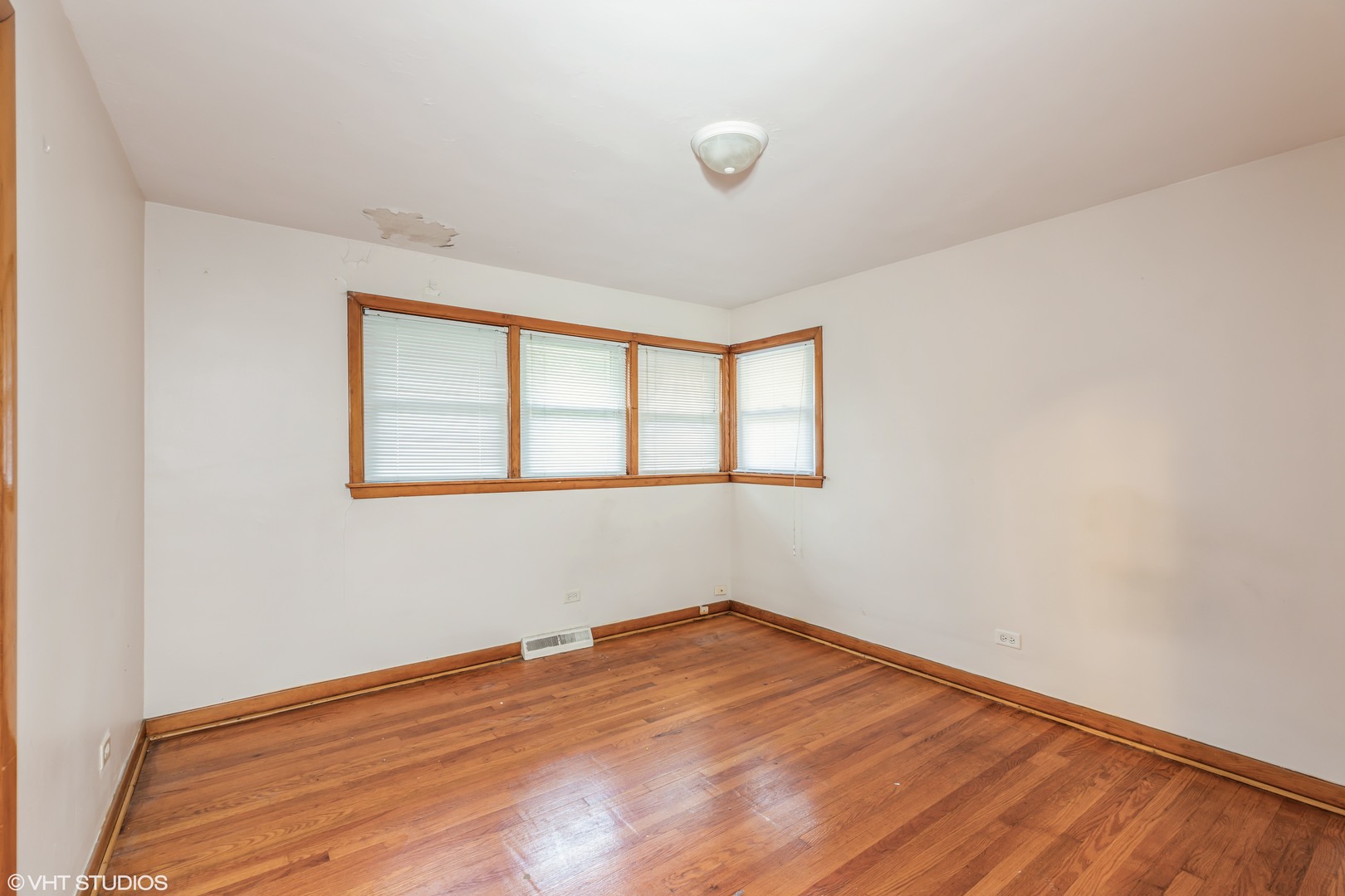 828 Exmoor Road Olympia Fields, IL 60461 - Photo 5 of 9 a view of empty room with wooden floor and fan